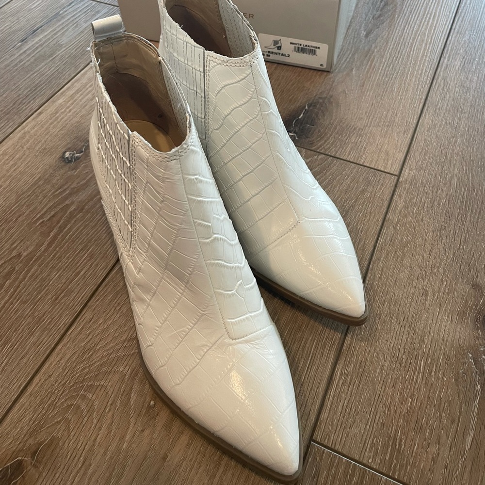 Marc Fisher white snake skin booties.